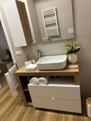 a bathroom with a sink and a mirror at Domus Gregorio VII in Rome