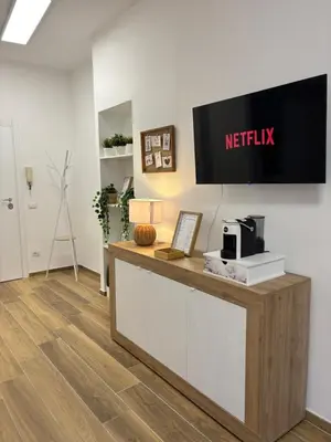 an office with a reception desk with a netflix sign on the wall at Domus Gregorio VII in Rome