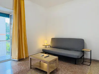 a living room with a couch and a table at Metro A Battistini - Ramat House in Rome