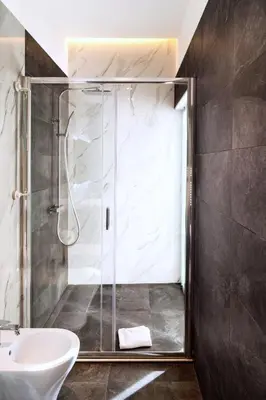 a bathroom with a shower and a sink at Ottavilla Apartment in Rome