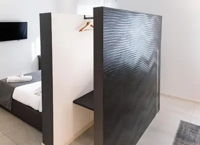 a sliding glass door in a bedroom with a bed at Ottavilla Apartment in Rome