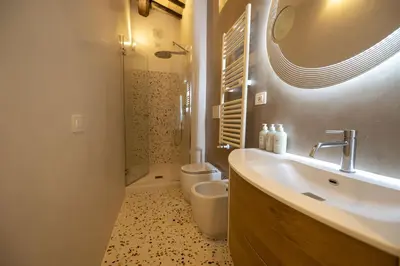 a bathroom with a sink and a toilet and a shower at Roman Dream in Campo de Fiori in Rome