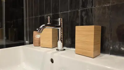 a bathroom sink with a faucet and two wooden blocks at Luì & Giò Luxury Suite in Rome