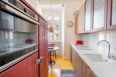 a kitchen with a sink and a counter top at Casa Medina, Charme in 5 min From Villa Borghese in Rome