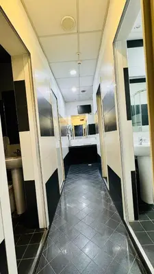 a hallway of a bathroom with two sinks at Star City Guest House in Rome