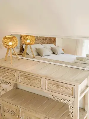 a bedroom with a bed with a wooden dresser at MamaCri rifugio d'inverno a Roma in Rome