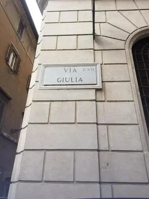 a sign on the side of a building at Stunning 2bedrooms apartment with AC Via Giulia in Rome