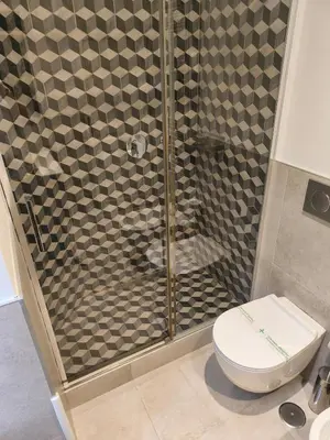 a bathroom with a shower with a toilet at Suite Tevere star in Rome