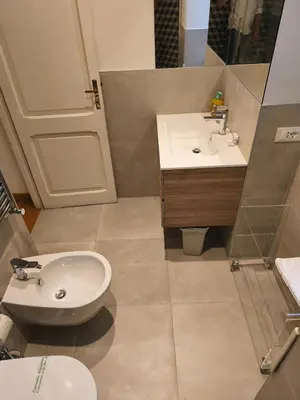 a bathroom with a sink and a toilet at Suite Tevere star in Rome