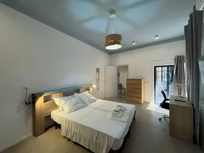 a bedroom with a large bed in a room at Cozy Corner in Magical Trastevere in Rome