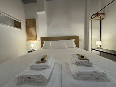 a bedroom with a bed with towels on it at Cozy Corner in Magical Trastevere in Rome