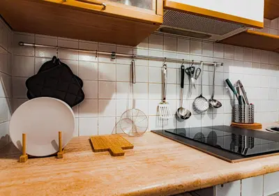 a kitchen with a counter top with utensils at Trastevere Urban Loft in Rome
