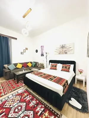 a bedroom with a bed and a couch at Caserina Lux Roma in Rome