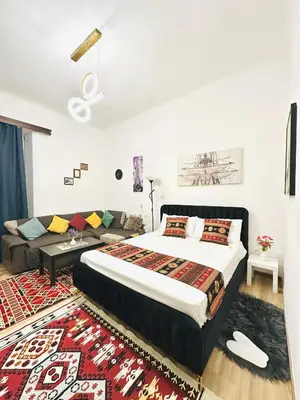 a bedroom with a large bed and a couch at Caserina Lux Roma in Rome