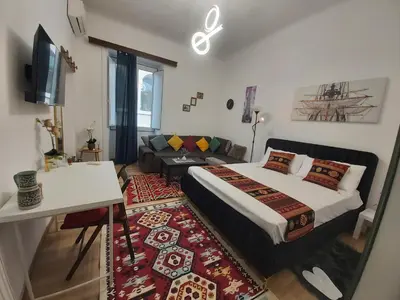 a bedroom with a bed and a living room at Caserina Lux Roma in Rome
