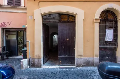 an entrance to a building with a large wooden door at Margherita Flat in Rome