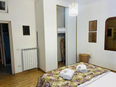 a bedroom with a bed with towels on it at Aventino The Yellow Home in Rome