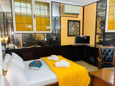 a room with a bed with towels on it at Aventino The Yellow Home in Rome