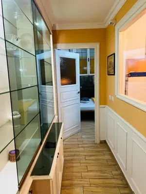 a walk in shower in a bathroom with a glass door at Aventino The Yellow Home in Rome