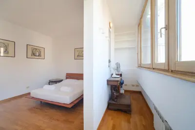 a bedroom with a bed and a window at Gian's Trevi BuddyRent in Rome