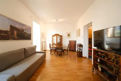 a living room with a couch and a table at Gian's Trevi BuddyRent in Rome