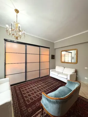 a living room with a couch and a mirror at La Canfora in Rome