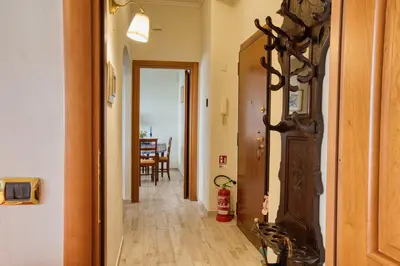a hallway with a door leading to a dining room at Pigneto84 in Rome