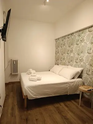 a bedroom with a bed with towels on it at Rome Tiburtina Terrace Inn - casa vacanze in Rome