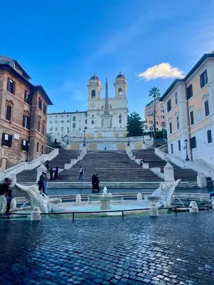 a crowd of people walking around a fountain in a city at night at Midorigami Jacuzzi suite Spanish Steps apt in Rome