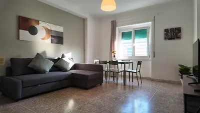 a living room with a couch and a table at Vatican St Peter Apartment in Rome