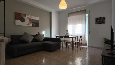 a living room with a couch and a table at Vatican St Peter Apartment in Rome