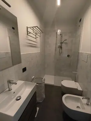a bathroom with a sink and a toilet and a shower at Romanello case e appartamenti vacanza in Rome
