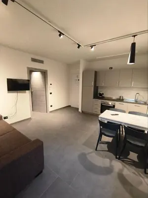 a large living room with a couch and a kitchen at Romanello case e appartamenti vacanza in Rome