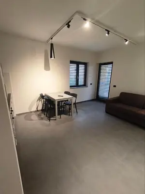 a living room with a table and a couch at Romanello case e appartamenti vacanza in Rome