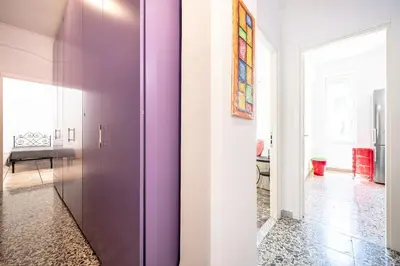 a purple door in a room with a hallway at Rome Sweet Home I Elegance and Authenticity in Rome