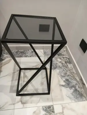 a glass table sitting on top of a floor at Feffo's home - Casa per 4 persone in Rome