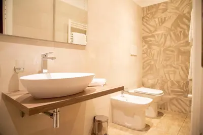 a bathroom with a sink and a toilet at Domus Napoleone in Rome