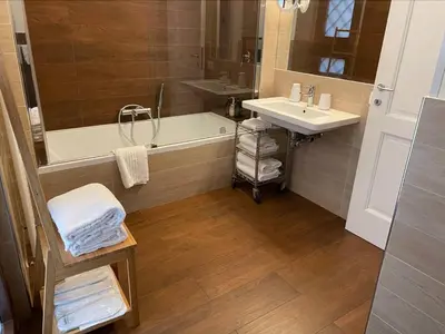 a bathroom with a bath tub and a sink at Civico43 in Rome