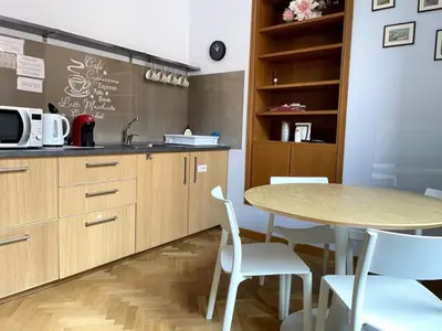 a kitchen with a table and a table and chairs at Civico43 in Rome