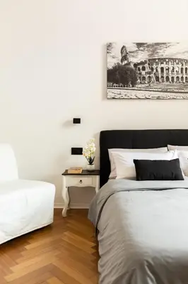 a bedroom with two beds and a table with a picture at Pantheon Winning Position in Rome