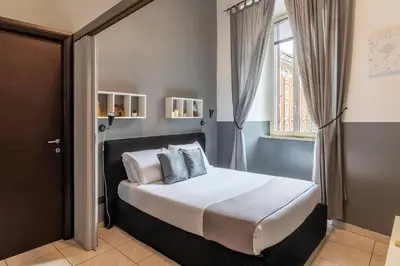 a bedroom with a bed and a window at Casa Mia Nazionale in Rome