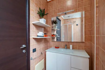 a bathroom with a sink and a mirror at Casa Mia Nazionale in Rome