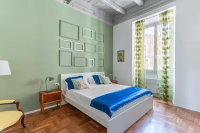 a bedroom with a bed and a window at Elegance near Navona-for 5 guests in Rome