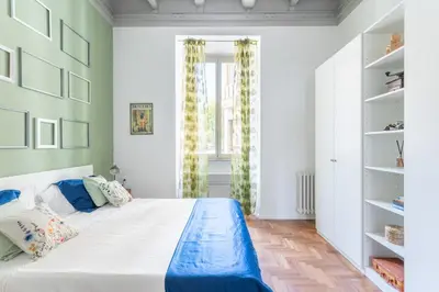 a bedroom with a large bed and a window at Elegance near Navona-for 5 guests in Rome