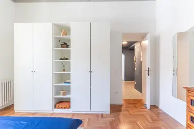 a bedroom with white cabinets and a hallway at Elegance near Navona-for 5 guests in Rome