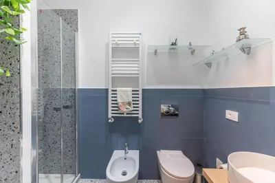 a bathroom with a toilet and a shower at Elegance near Navona-for 5 guests in Rome