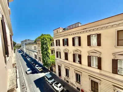 an overhead view of a city street with parked cars at ETERNA Repubblica Apartment in Rome