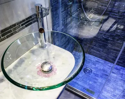 a glass sink with a faucet in front of a window at Vaticano Julia Guest House in Rome