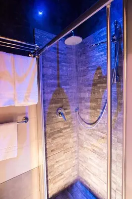 a shower with a glass door in a bathroom at Vaticano Julia Guest House in Rome