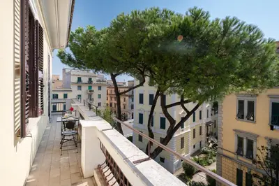 a tree on the balcony of a building at Pigneto House - Residenze Romanae in Rome
